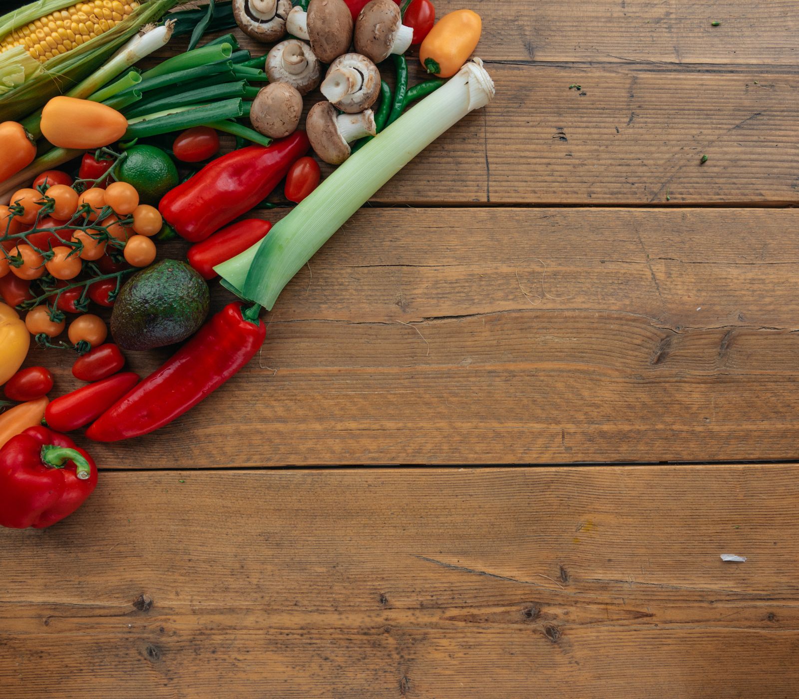 Fresh corn, peppers, tomatoes, mushrooms and green vegetables